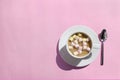 Cup of hot cocoa/coffee with marshmallows on pink table, top view, flat lay. Royalty Free Stock Photo