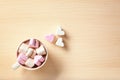 Cup with hot cocoa drink and marshmallows on table, top view Royalty Free Stock Photo