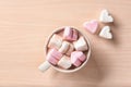 Cup with hot cocoa drink and marshmallows on table, top view Royalty Free Stock Photo