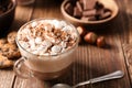 Cup with hot cocoa drink and marshmallows on wooden table Royalty Free Stock Photo