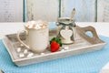 Cup of hot cocoa with marshmallows and strawberry