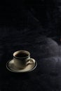 a cup of hot coffee on a black background. dark scene. banner space mock-up for adding text Royalty Free Stock Photo