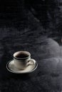 a cup of hot coffee on a black background. dark scene. banner space mock-up for adding text Royalty Free Stock Photo