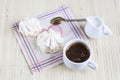 Cup of hot coffee with books, milk and flowers on wooden table Royalty Free Stock Photo