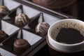 A cup of hot coffee and chocolate sweets Royalty Free Stock Photo