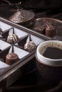 A cup of hot coffee and chocolate sweets Royalty Free Stock Photo