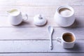 Cup of hot coffee espresso, coffee beans, jug of milk, and bowl with sugar on white background for copy space. Coffee Royalty Free Stock Photo