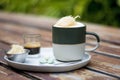 A cup of Hot Coffee with extra shot, sugar cotton candy and with thai traditional snacks on white plate Royalty Free Stock Photo