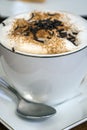 Cup of hot, coffee latte with chocolate flakes