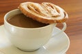 Cup of hot coffee and palmier cookie Royalty Free Stock Photo