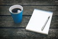 Cup of hot coffee, pen and notepad, blank sheet of paper. Business plan. Writing poetry. Royalty Free Stock Photo