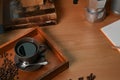 Cup of hot coffee and roasted coffee beans on wooden table. Royalty Free Stock Photo