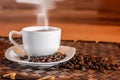 Cup of hot Coffee with smoke and coffee bean Royalty Free Stock Photo