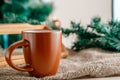 Cup with a hot drink on the wooden table with Christmas decorations Royalty Free Stock Photo