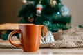 Cup with a hot drink on the wooden table with Christmas decorations Royalty Free Stock Photo