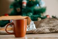 Cup with a hot drink on the wooden table with Christmas decorations Royalty Free Stock Photo