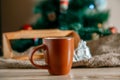 Cup with a hot drink on the wooden table with Christmas decorations Royalty Free Stock Photo