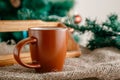 Cup with a hot drink on the wooden table with Christmas decorations Royalty Free Stock Photo