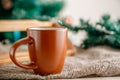 Cup with a hot drink on the wooden table with Christmas decorations Royalty Free Stock Photo
