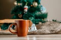 Cup with a hot drink on the wooden table with Christmas decorations Royalty Free Stock Photo