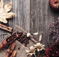 Cup of hot espresso among autumn plants on wooden vintage table, coffee on the old board grunge including dried plants Royalty Free Stock Photo