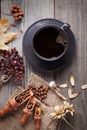 cup of hot espresso among autumn plants on wooden vintage table, coffee on the old board grunge including dried plants Royalty Free Stock Photo