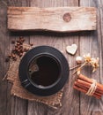 cup of hot espresso among autumn plants on wooden vintage table, coffee on the old board grunge including dried plants Royalty Free Stock Photo