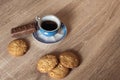 A cup of hot fragrant black coffee in a saucer with cookies and a chocolate bar Royalty Free Stock Photo