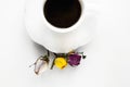 A cup of hot fresh black coffee with foam on a white background. Coffee cup on a round saucer centered inside the frame. Top view Royalty Free Stock Photo