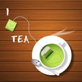 A cup of hot green tea and tea bag with steam Royalty Free Stock Photo