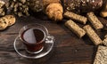 A cup of hot herbal tea and cookies on the old wooden background Royalty Free Stock Photo