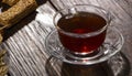 A cup of hot herbal tea and cookies on the old wooden background Royalty Free Stock Photo