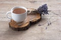 A cup of hot herbal tea and lavender on an old wooden background. Royalty Free Stock Photo