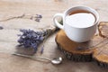 A cup of hot herbal tea and lavender on an old wooden background. Royalty Free Stock Photo