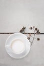 Cup of hot latte art coffee on wooden floor White color background and dry flower, in top view Royalty Free Stock Photo