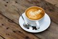 Cup of hot latte art coffee Royalty Free Stock Photo