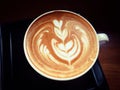 Cup of hot latte or cappuccino with fascinating latte art