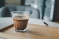 Cup of hot mocha coffee on the table. Coffee in a small glass cup Royalty Free Stock Photo