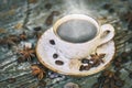 Cup of hot steaming coffee on the old scratched table Royalty Free Stock Photo