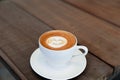 Cup of hot tasty cappucino with smile as art latte Royalty Free Stock Photo