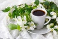 Cup of hot tasty coffee in very spring floral setting. Full of white and very cute pink color. Romantic decor elements