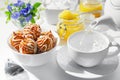 Cup of hot tea with cookies and honey on a white background. The process of pouring boiling water, tea bags. Selective focus Royalty Free Stock Photo