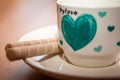 Cup of hot tea with delicious cookies on wooden table Royalty Free Stock Photo