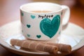 Cup of hot tea with delicious cookies on wooden table Royalty Free Stock Photo