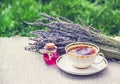 Cup of hot tea and lavender essential oil. Natural medicine for colds. Tea with lavender and remedy. A healing potion. Royalty Free Stock Photo