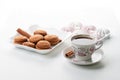 cup of hot tea marshmallow cookies cinnamon selective focus on white background high key Royalty Free Stock Photo