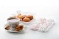 cup of hot tea marshmallow cookies cinnamon selective focus on white background high key Royalty Free Stock Photo