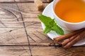 Cup of hot tea with mint and brown sugar on a wooden table Copy sapce Royalty Free Stock Photo