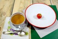 A cup of hot tea with one tomato - healthy food Royalty Free Stock Photo