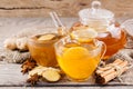 Cup of hot tea and a teapot. ginger, cinnamon, anise, cookies and spruce branches